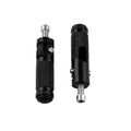 Two black aluminium alloy round folding motorcycle foot pedals on a workbench