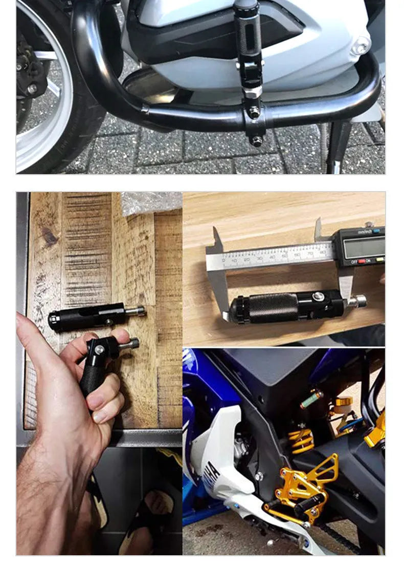 Two black aluminium alloy round folding motorcycle foot pedals on a workbench