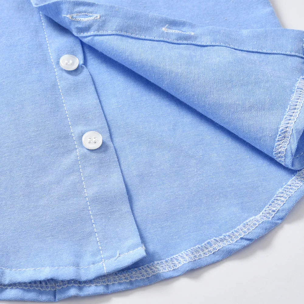 Blue boys' formal pantsuit with bib-style top, long sleeves, and a matching bow tie.