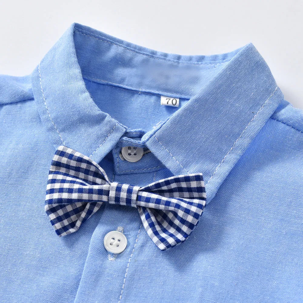 Blue boys' formal pantsuit with bib-style top, long sleeves, and a matching bow tie.