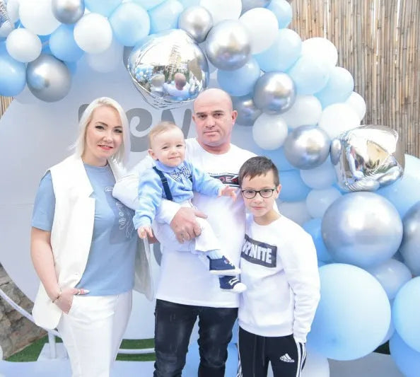 Blue boys' formal pantsuit with bib-style top, long sleeves, and a matching bow tie.