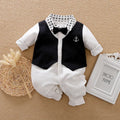 A long-sleeved gentleman's style baby romper made from cotton, shown in a classic colour.