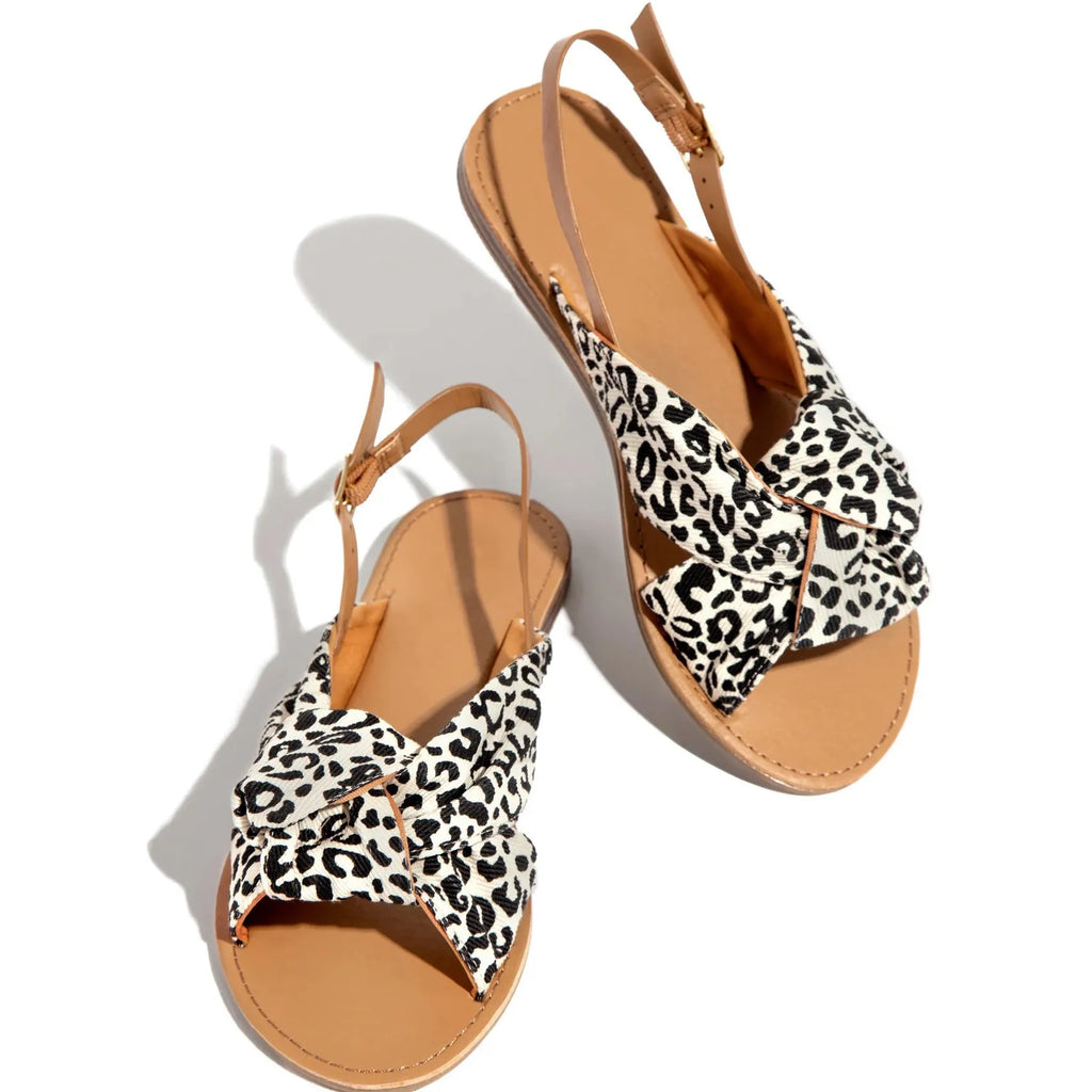 Women flat sandals in denim blue with low heel and slip-on design for summer beach wear.