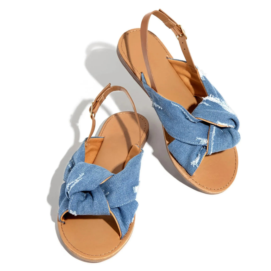 Women flat sandals in denim blue with low heel and slip-on design for summer beach wear.