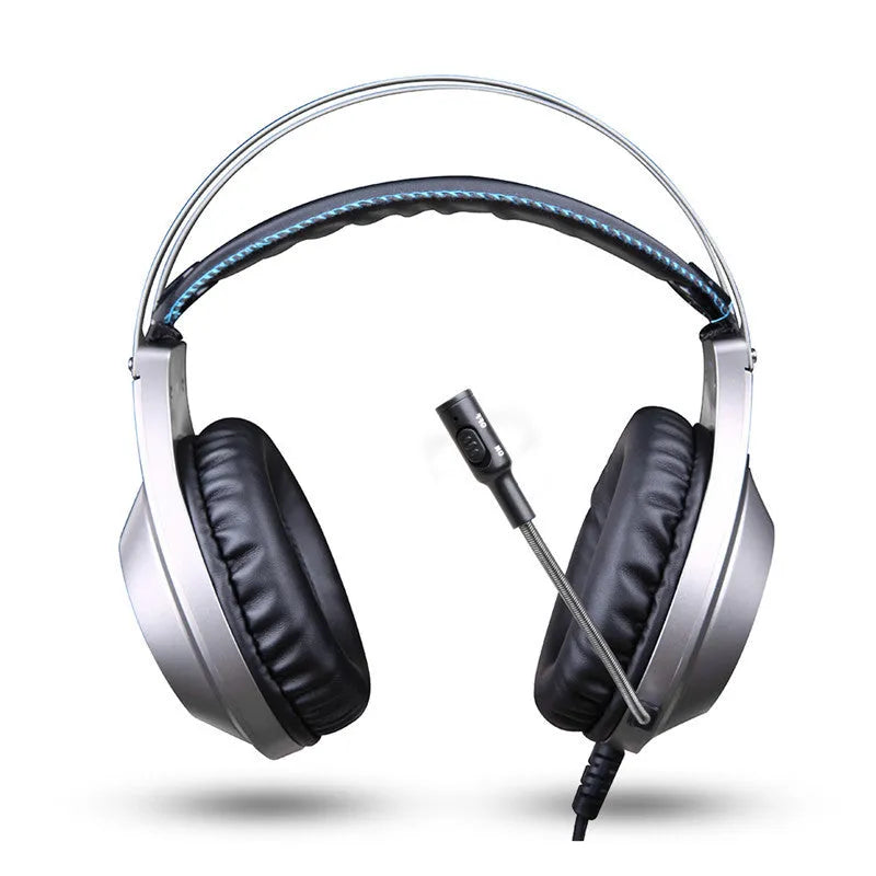 Black wired USB over-ear computer gaming headset with a microphone on a desktop.