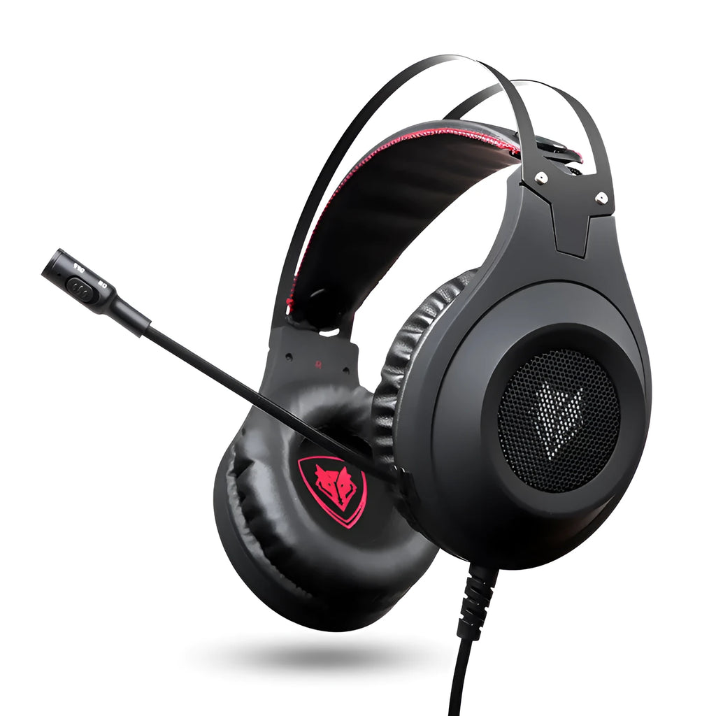 Black wired USB over-ear computer gaming headset with a microphone on a desktop.