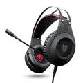 Black wired USB over-ear computer gaming headset with a microphone on a desktop.