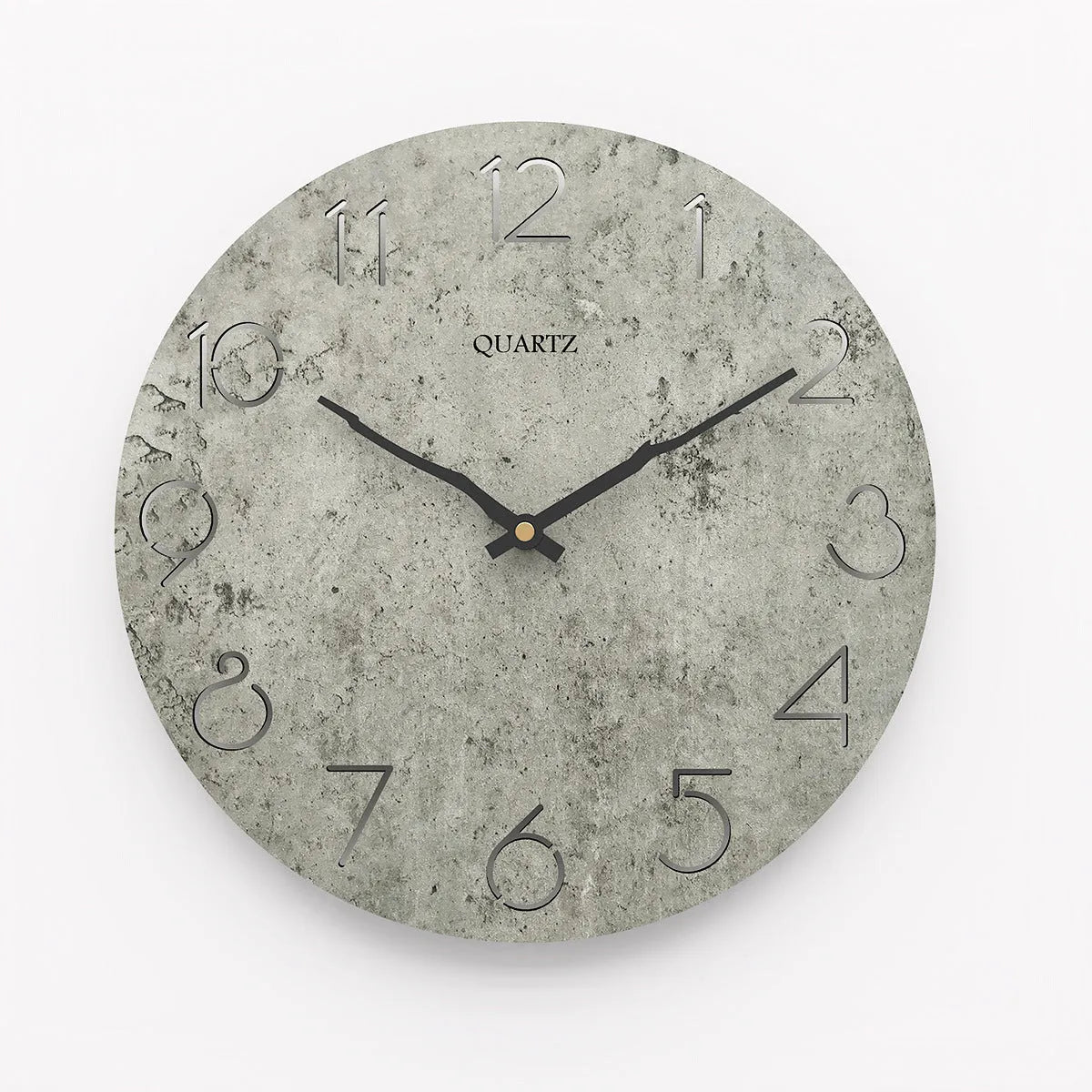 Modern grey European-style wall clock with a round face on a white wall.