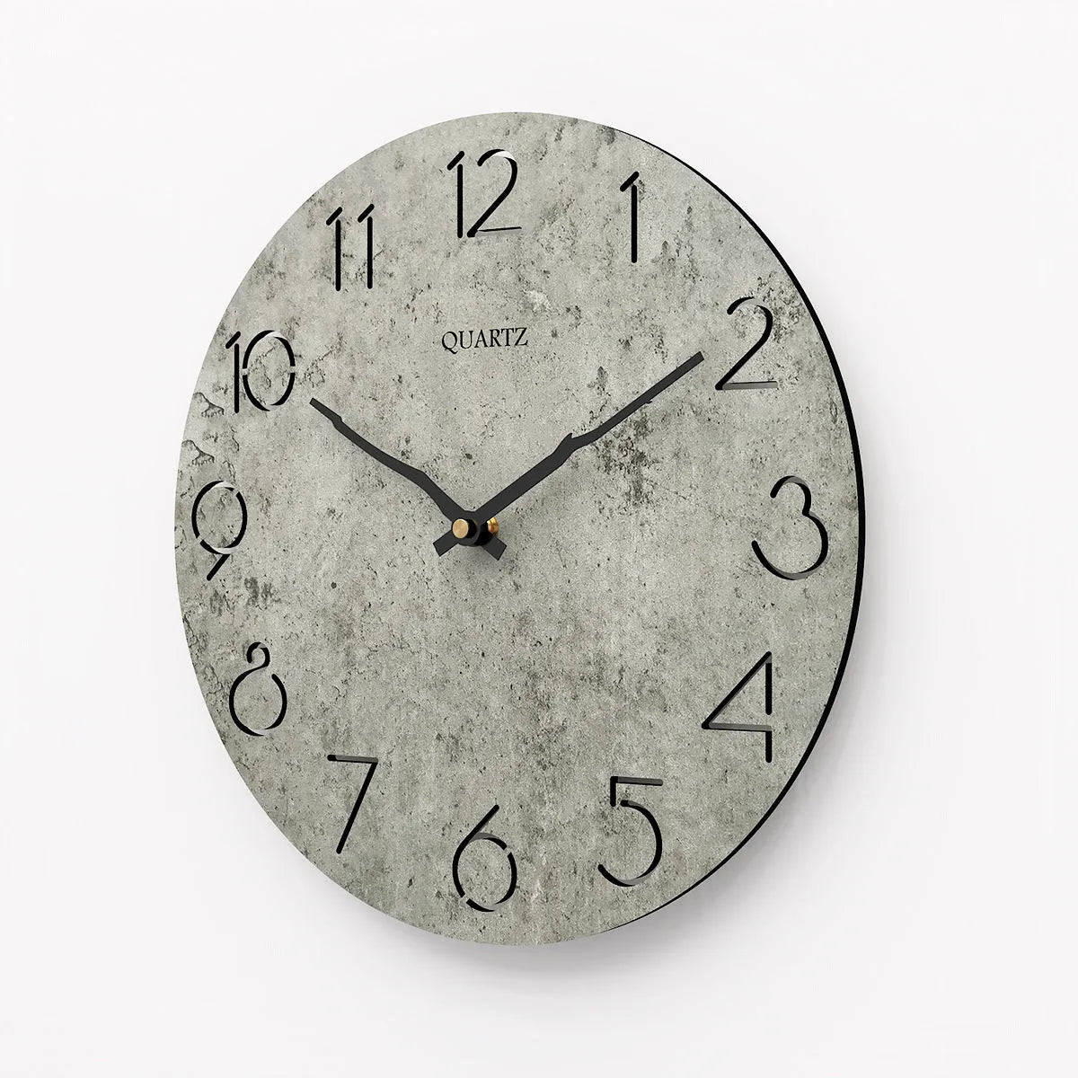 Modern grey European-style wall clock with a round face on a white wall.