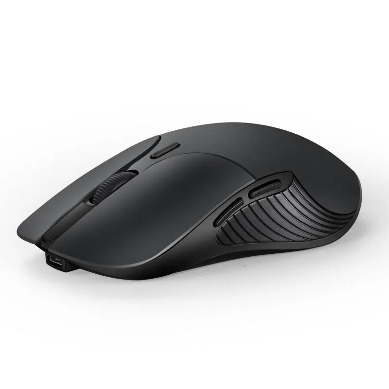 Blue wireless voice translation mouse with scroll wheel and voice control button on a desk.