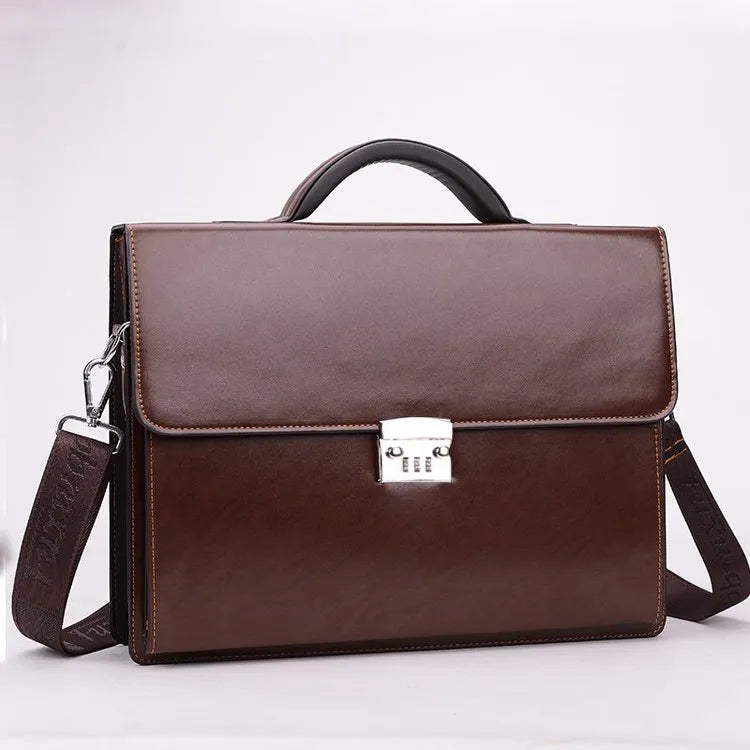 Black men's PU leather business briefcase with a top handle and shoulder strap on a desk