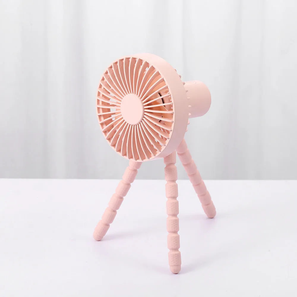 Small adjustable desktop fan with flexible tripod and bending head, shown in white colour.
