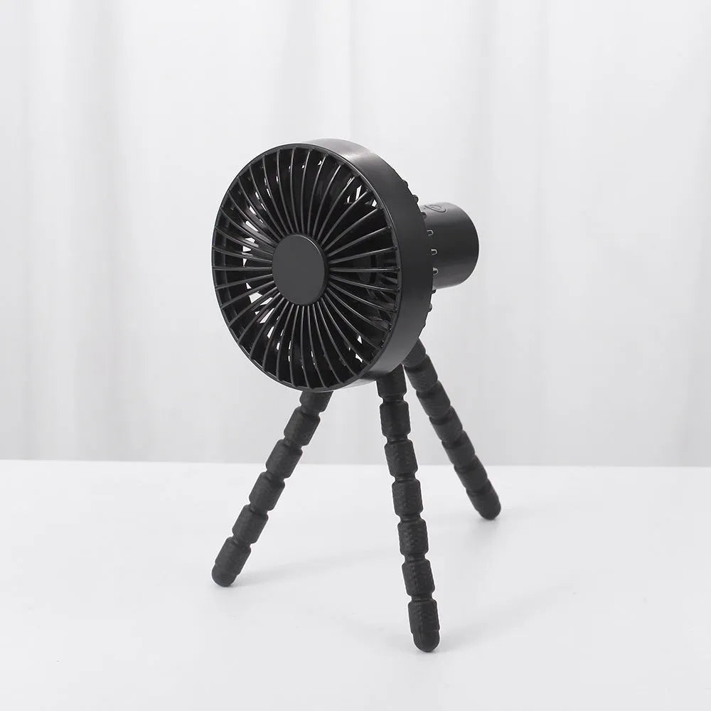 Small adjustable desktop fan with flexible tripod and bending head, shown in white colour.