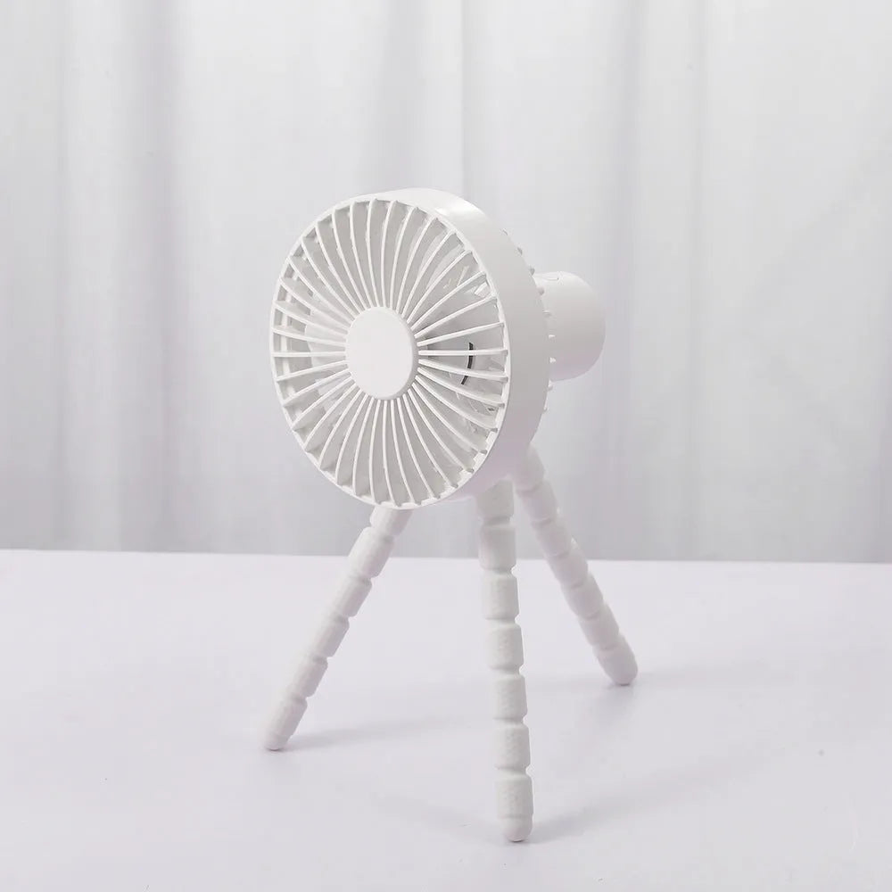Small adjustable desktop fan with flexible tripod and bending head, shown in white colour.
