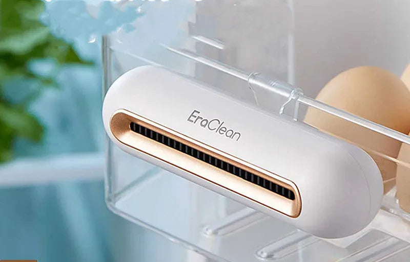 Rose gold USB-powered car air purifier and deodoriser with push-button control.