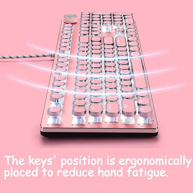 Queen Lipstick mechanical keyboard with green switches, white backlight, silver base, pink accents, and wired USB mouse on a desk.