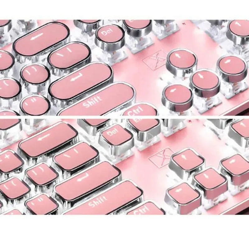 Queen Lipstick mechanical keyboard with green switches, white backlight, silver base, pink accents, and wired USB mouse on a desk.