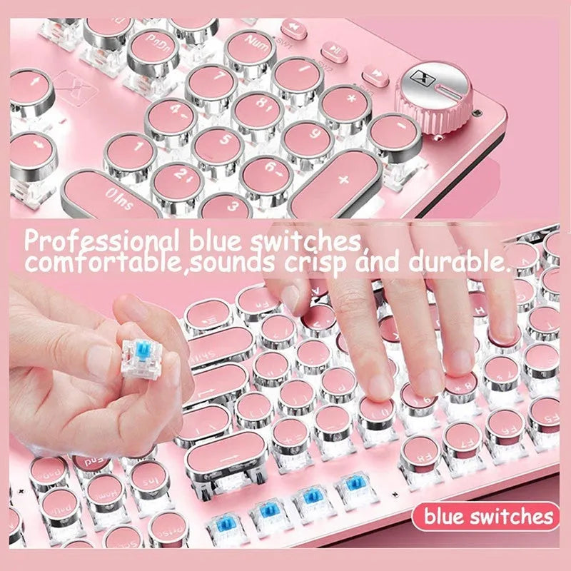 Queen Lipstick mechanical keyboard with green switches, white backlight, silver base, pink accents, and wired USB mouse on a desk.