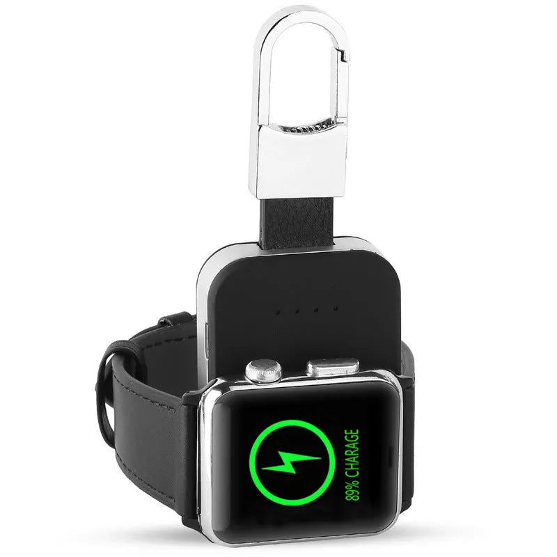 Black Apple Watch wireless keychain power bank showing compact size and charging surface.