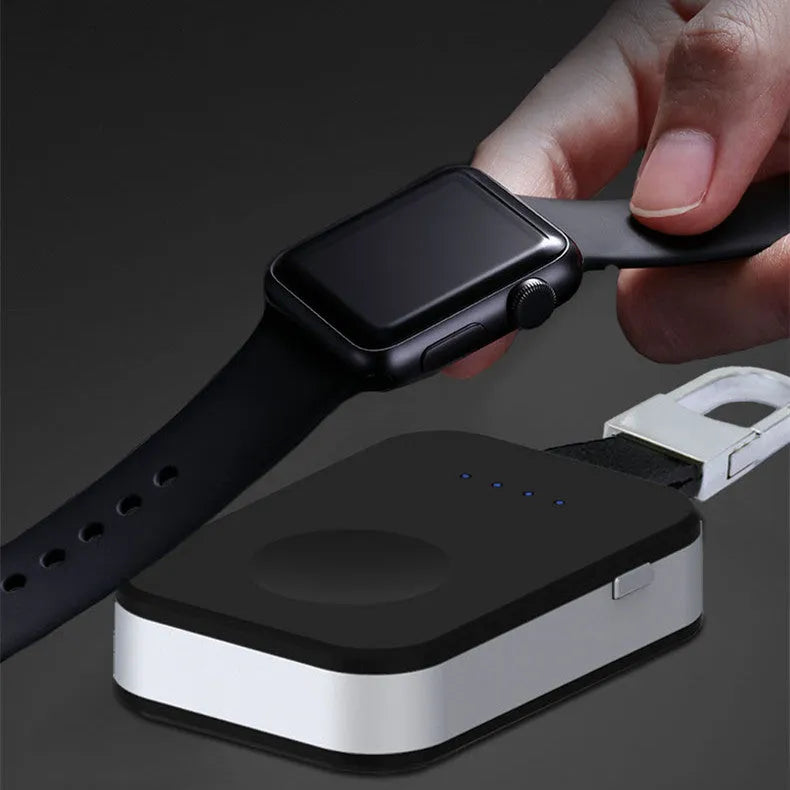 Black Apple Watch wireless keychain power bank showing compact size and charging surface.