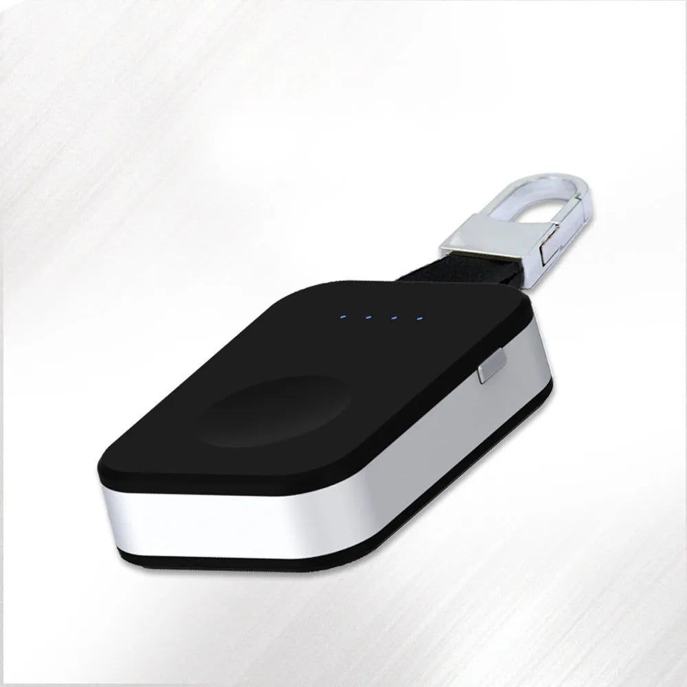Black Apple Watch wireless keychain power bank showing compact size and charging surface.