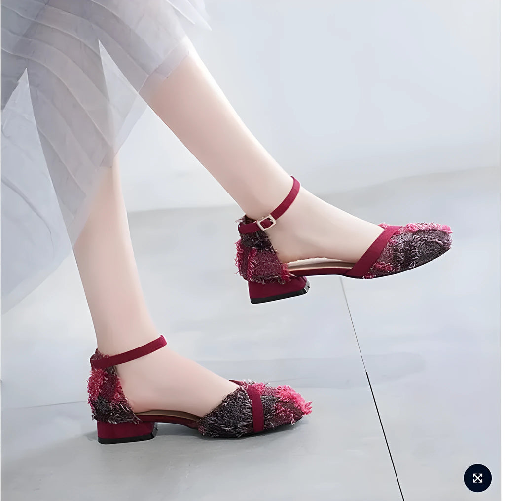 Women's apricot suede D'Orsay flats with an ankle strap and 3cm low heel on a wooden floor.