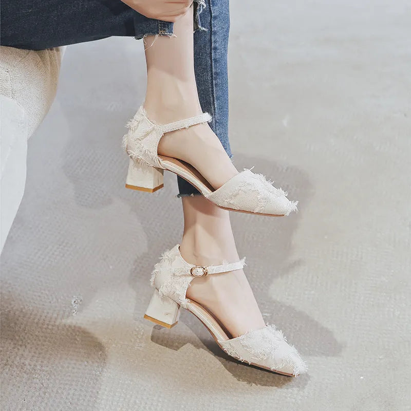 Women's apricot suede D'Orsay flats with an ankle strap and 3cm low heel on a wooden floor.