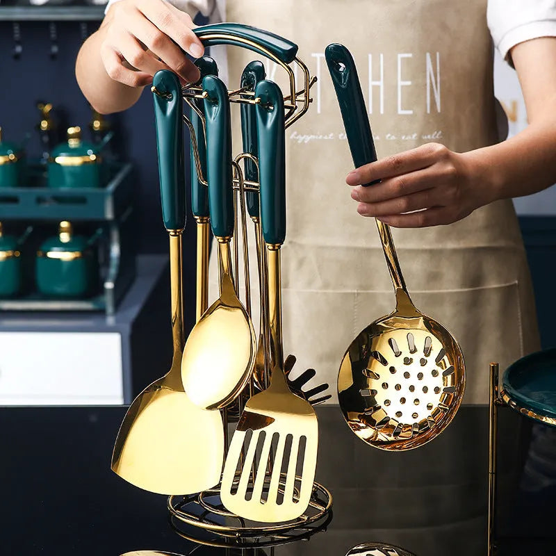 7-piece stainless steel kitchen utensil set including slotted spatula, turner, ladle, serving spoon, and pasta server