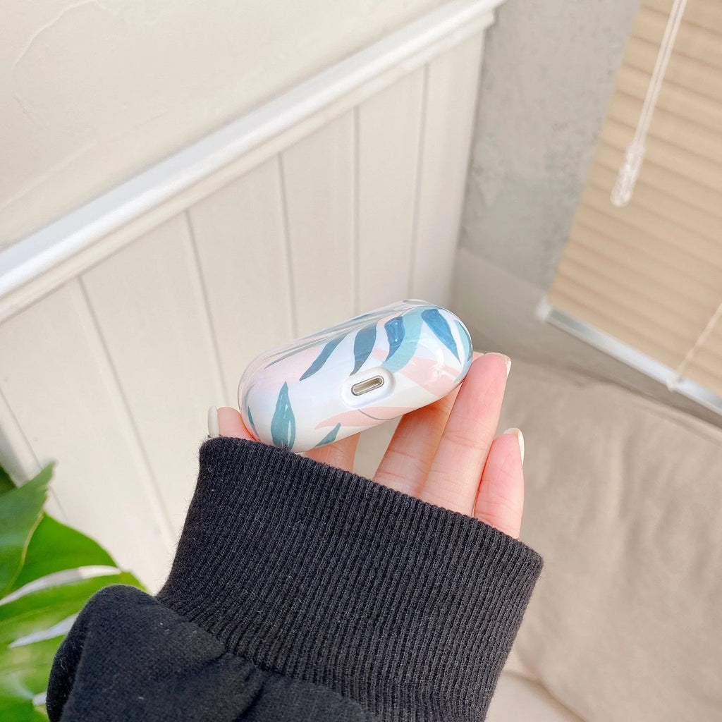 Blue TPU AirPods case cover with a painted tropical banana leaves design.