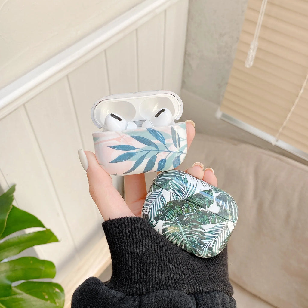Blue TPU AirPods case cover with a painted tropical banana leaves design.