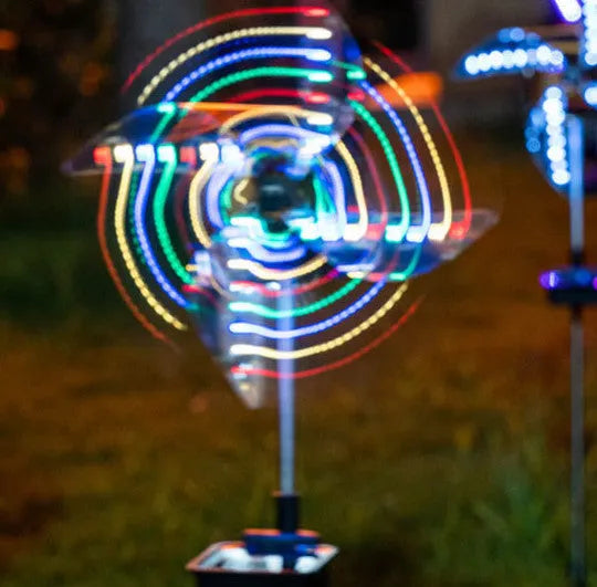 Solar wind spinner light with LED and IP65 rating, featuring spinning windmill decoration for garden paths in four colour options
