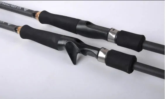 Telescopic carbon fishing rod with matte coating and reel seat on a lakeside bank