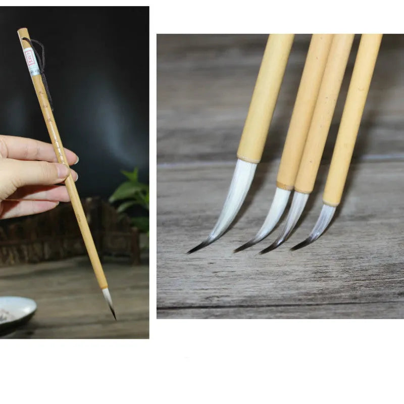 Four gold-coloured thin writing brushes with pine branch design, size 0, on a flat surface.