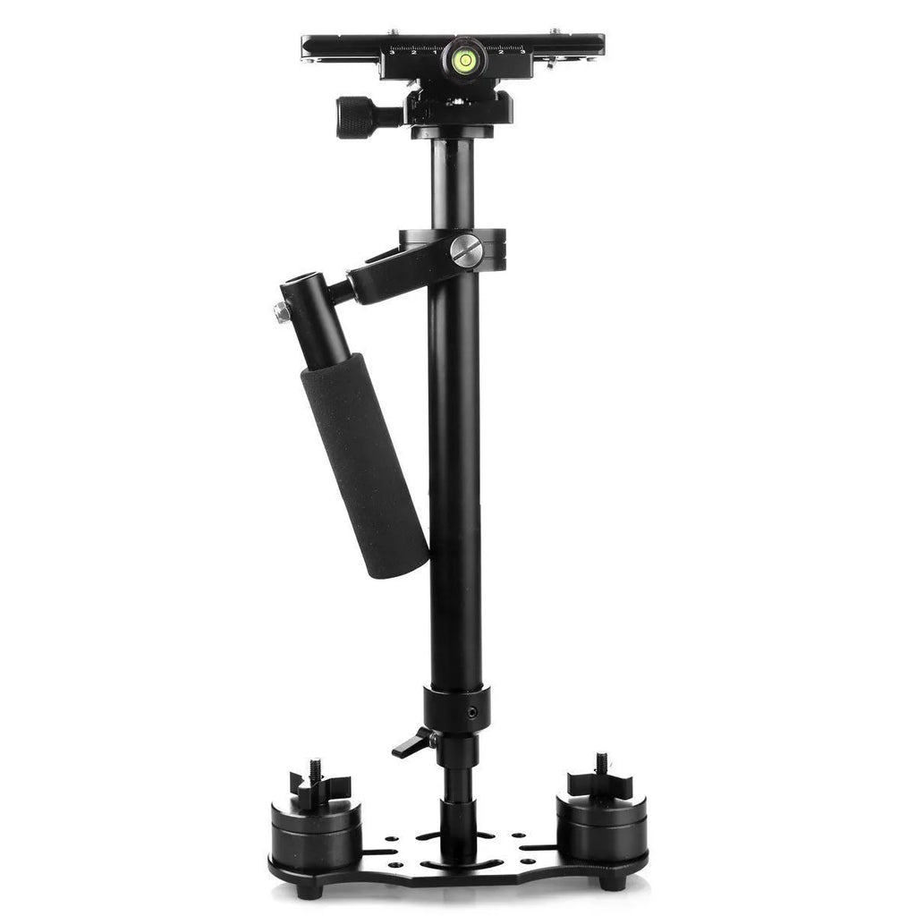 Black aluminium handheld camera stabiliser with adjustable height on a table.