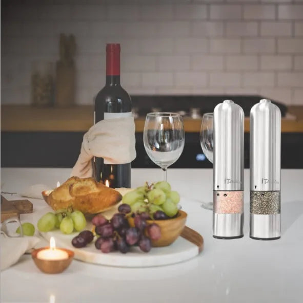 Stainless steel electric pepper grinder with manual option in natural colour.