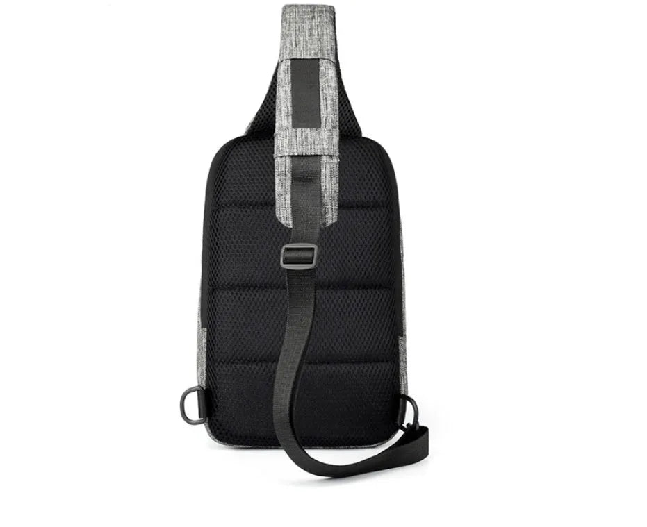 Dark blue Oxford cloth chest bag with adjustable strap, shown open to reveal internal mobile phone pocket.