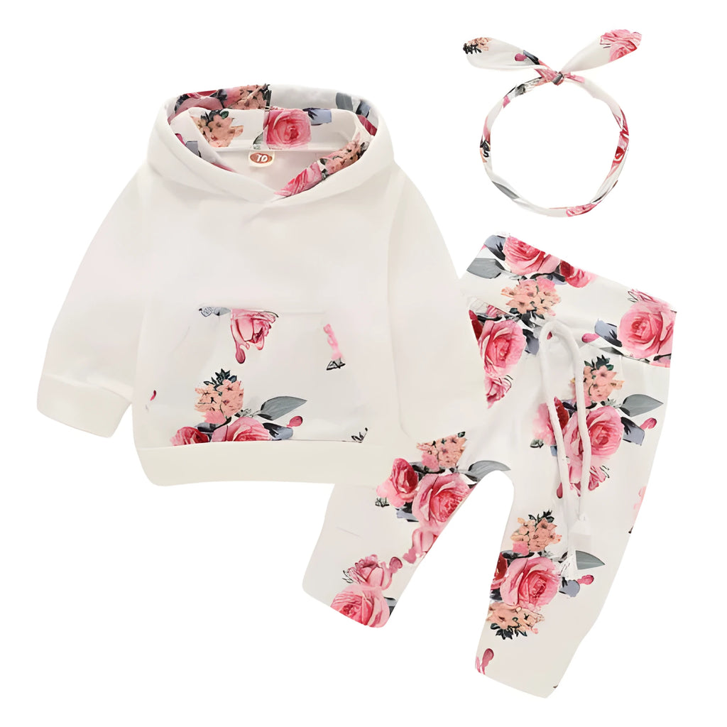 White cotton hooded romper suit for a baby girl with long sleeves and trouser legs.