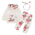 White cotton hooded romper suit for a baby girl with long sleeves and trouser legs.