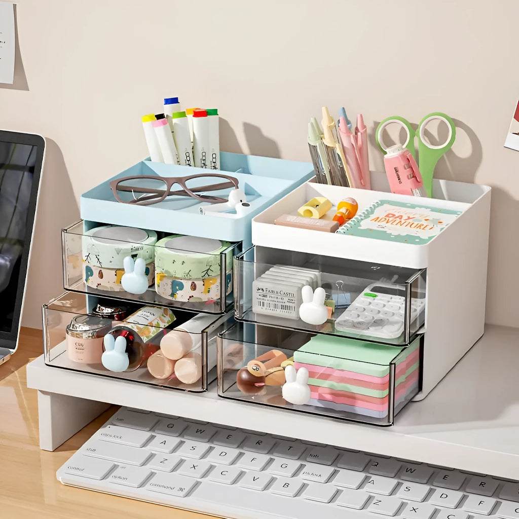 Transparent plastic desktop storage box with internal grid partitions, shown in pink colour.
