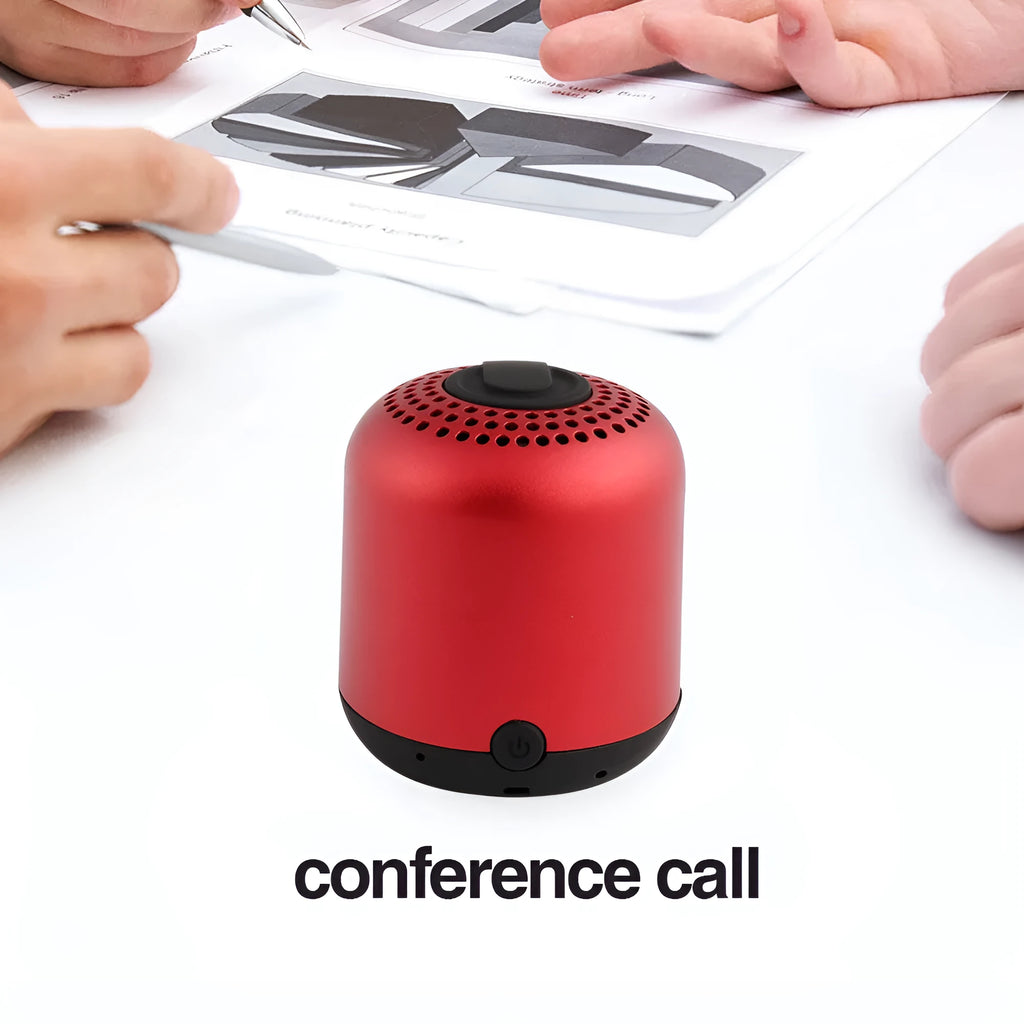 Hieha XQ11 cylindrical portable Bluetooth speaker in silver colour on a table.