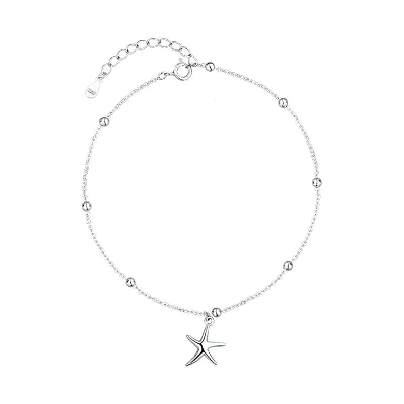 Adjustable sterling silver anklet with a small starfish charm and round beads on a fine chain.