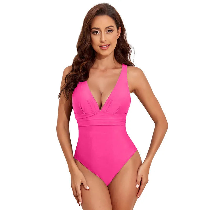 Women's solid colour cross shoulder one-piece nylon swimsuit on a model.
