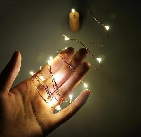 Flexible copper wire LED string lights with 20 warm white bulbs and plastic bottle stopper for wine bottle decoration
