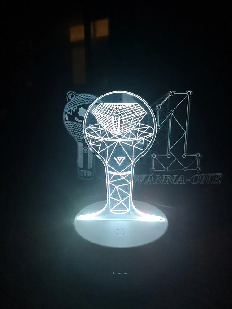 Clear acrylic stand for BTS Light 101 BTS Tower Gem album display on a table.