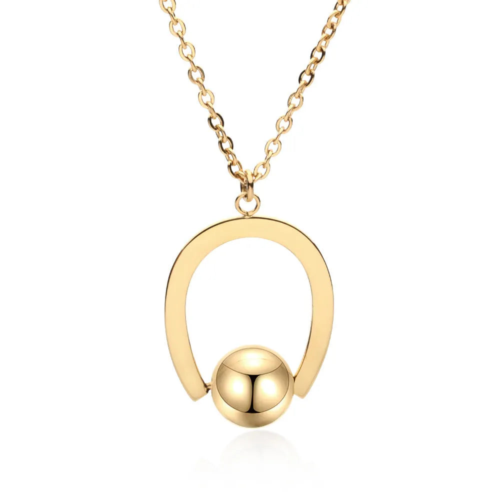 Stainless steel geometric pendant necklace on a cross chain, shown in a gold colour finish.