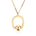 Stainless steel geometric pendant necklace on a cross chain, shown in a gold colour finish.