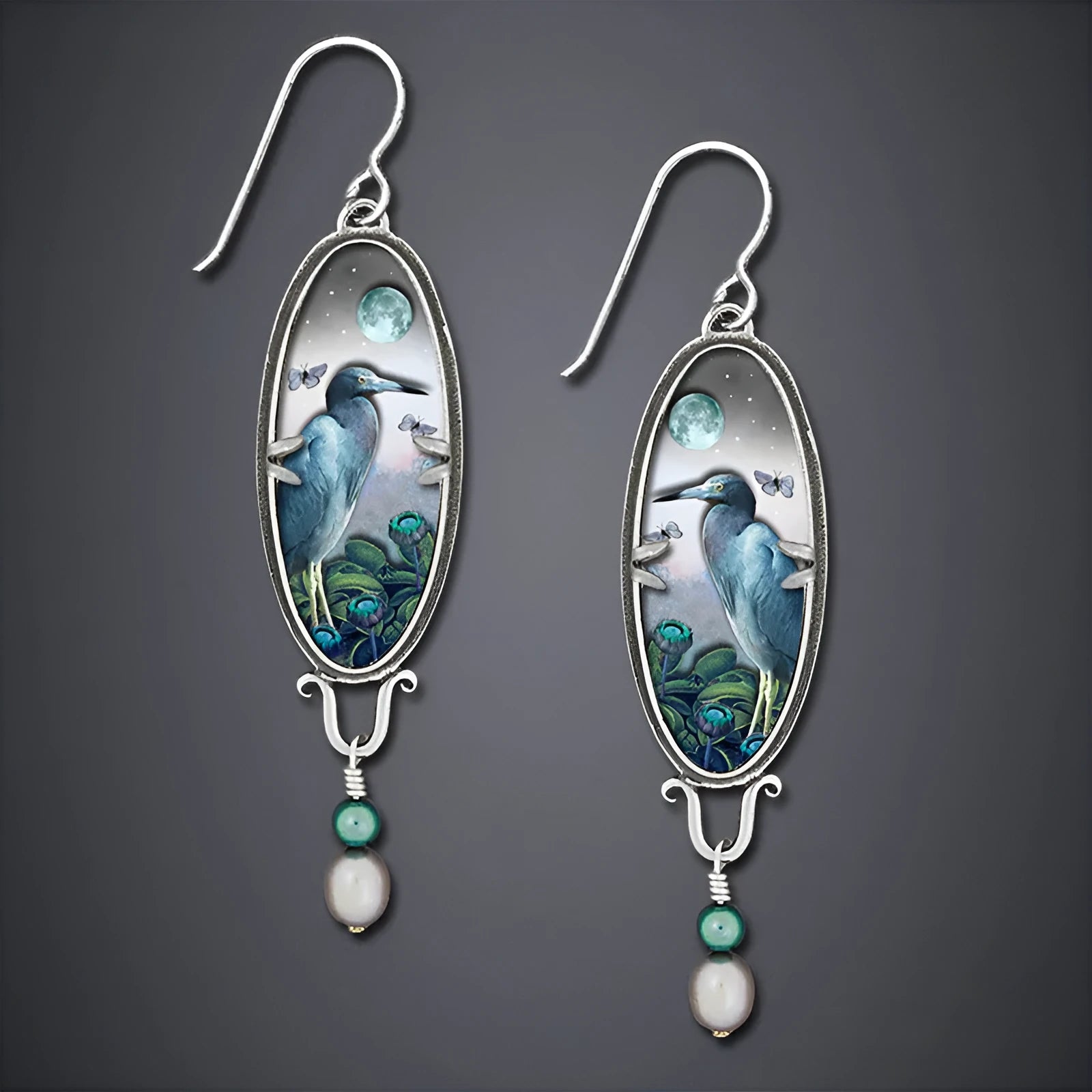Silver retro-style drop earrings with a creative bird and flower design.
