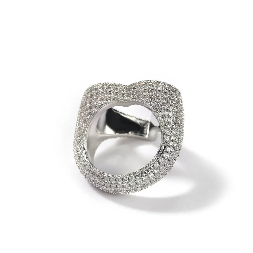 Gold copper ring with hollow heart cut-out and zircon stone on finger