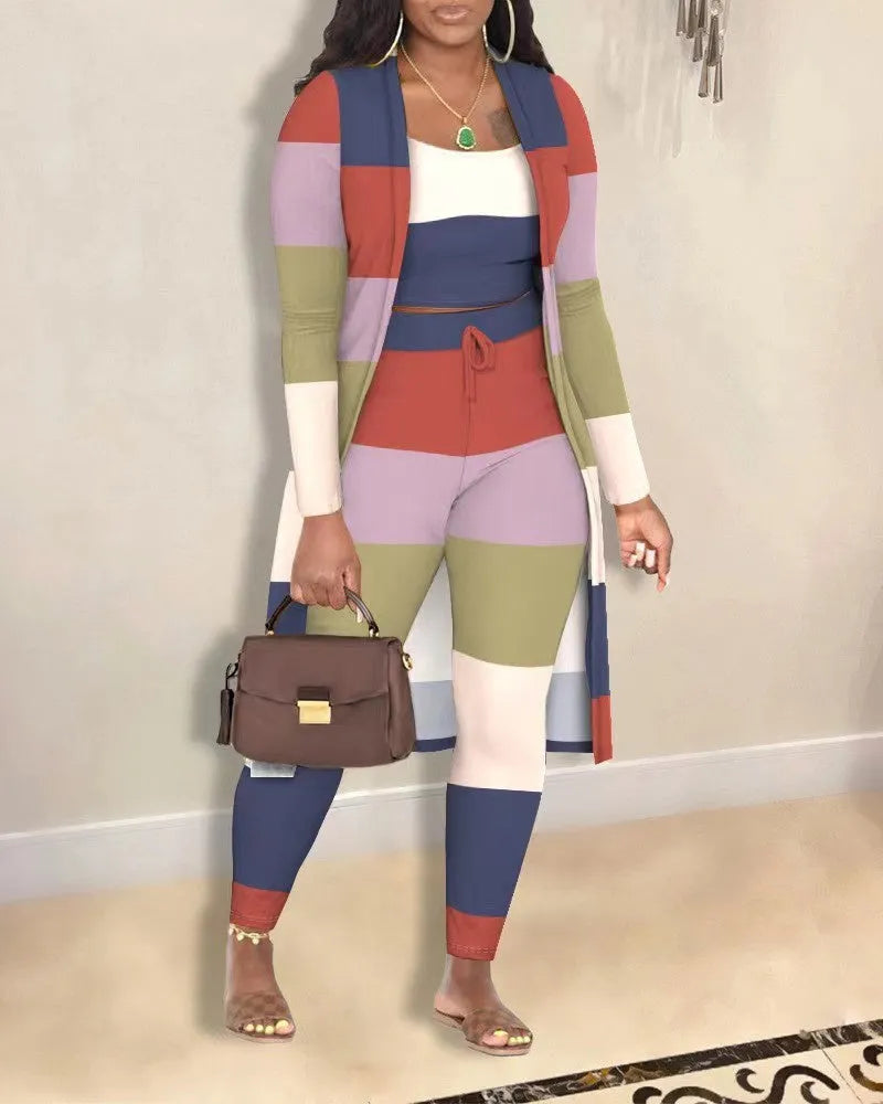 Women's multicolour plaid three-piece set with long sleeve coat, vest and trousers on model
