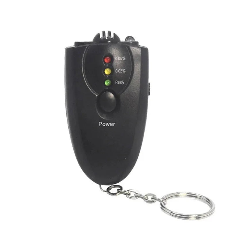 Black portable wine tester with LED display and keychain against a white background